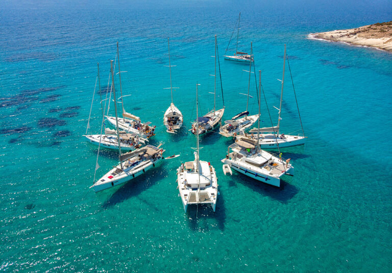yachts in a circle in the ocean on a yacht charter