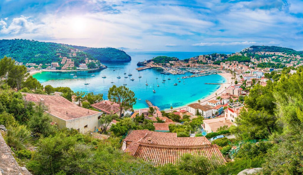 Yachts anchored in the round bay of Port de Sóller, Mallorca, in Spain's Balearic Islands